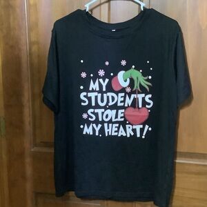 Christmas Grinch Teacher’s Black Shirt with Heart and Text Design